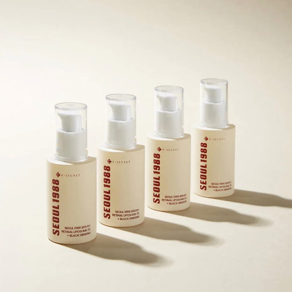 Application du sérum de nuit KSECRET SEOUL 1988 Retinal Liposome 2% sur la peau du visage.
