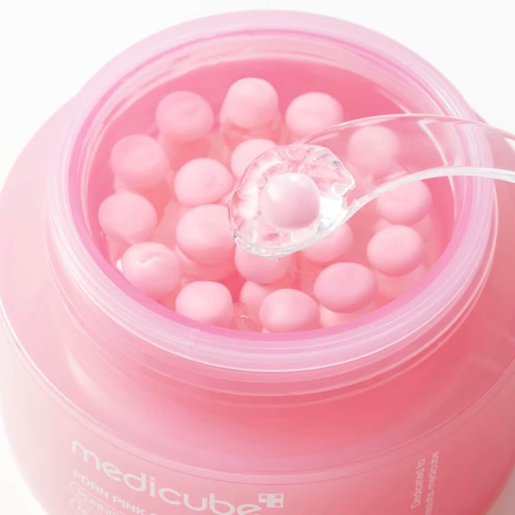 Application et fusion des capsules PDRN Medicube sur la peau pour un effet glass skin rosé.