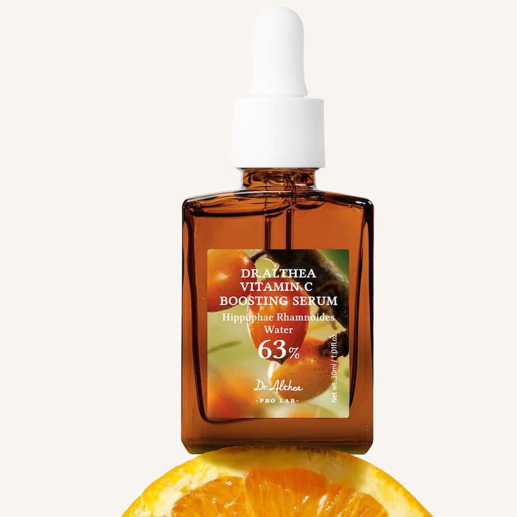 Aesthetic presentation of Dr. Althea's Vitamin C Boosting Serum. A bright atmosphere evoking the freshness of citrus and the energy of revitalizing active ingredients.